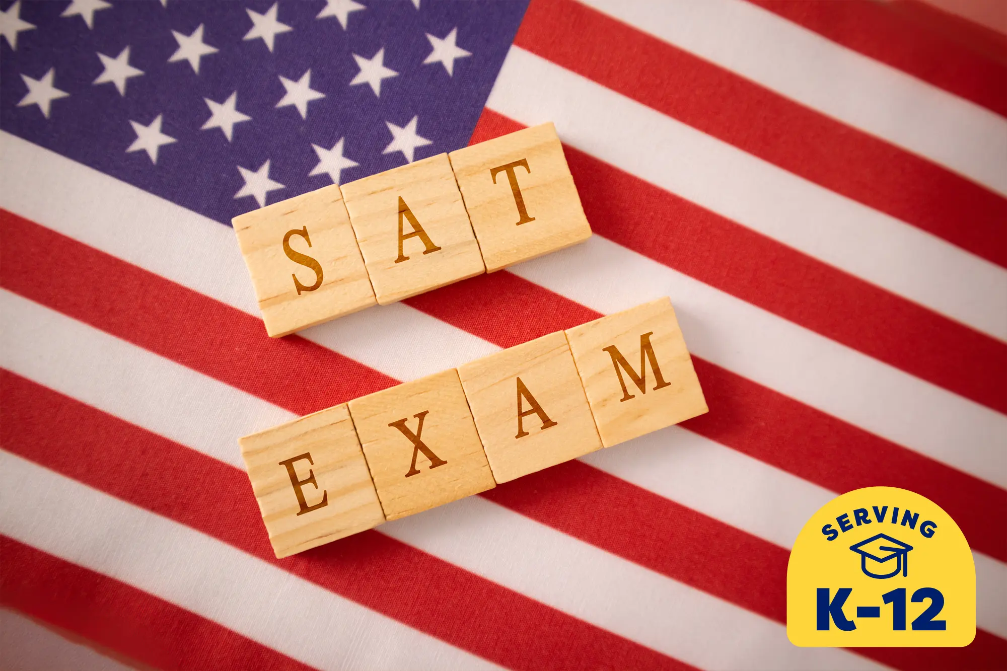 SAT EXAM spelt out using wooden tiles on an American flag